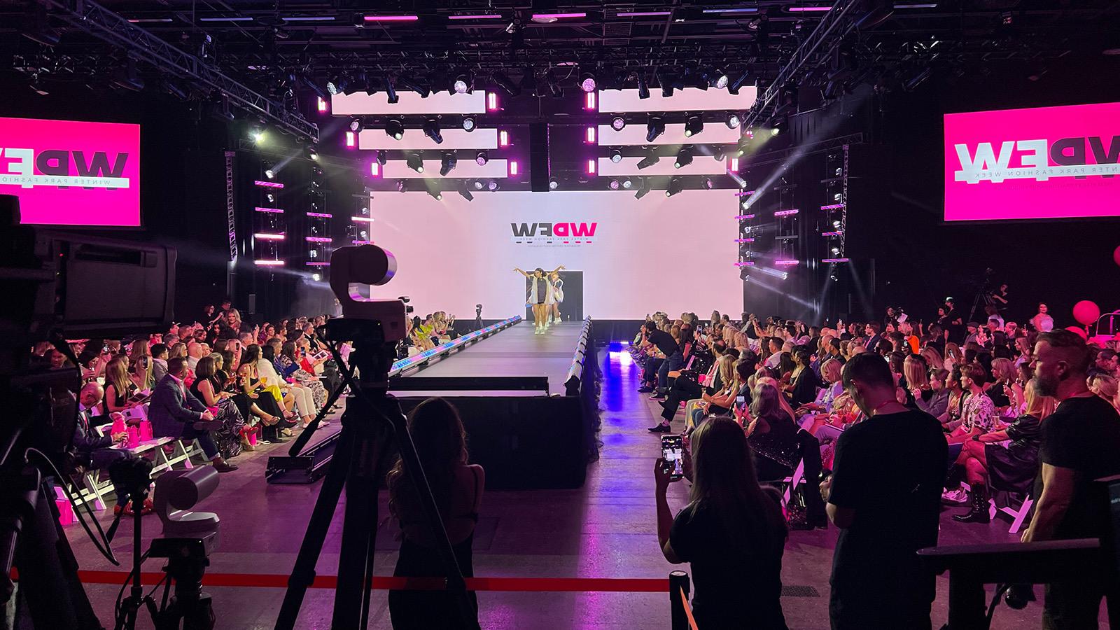 Audience gathers at the Full Sail Live venue to attend the Winter Park Fashion Show.