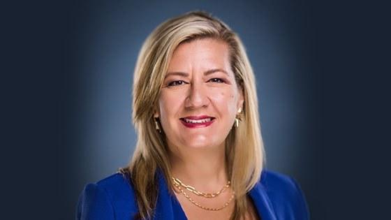 Headshot of Dr. Heather Dartez smiling, wearing a blue blazer.