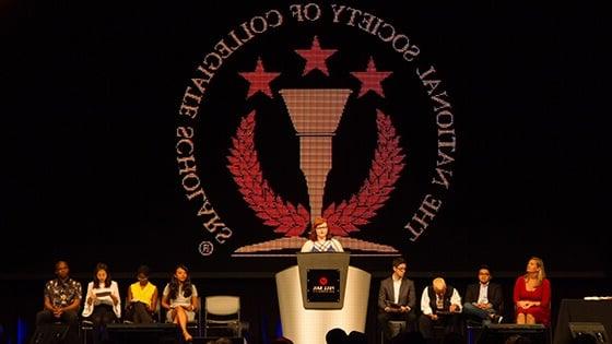 满帆’s National Society of Collegiate Scholars chapter members on stage at an NSCS ceremony.