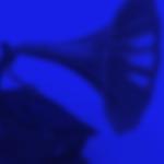 A graphic of a gramophone on a blue background. The words 2023 Latin Grammys are overlaid in white.