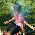 Students throw colored powder at the Holi Festival of Colors.